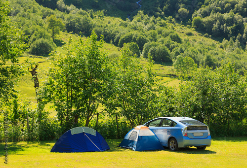 Family camping in the car and two tents. summer holiday. Norway, Europe