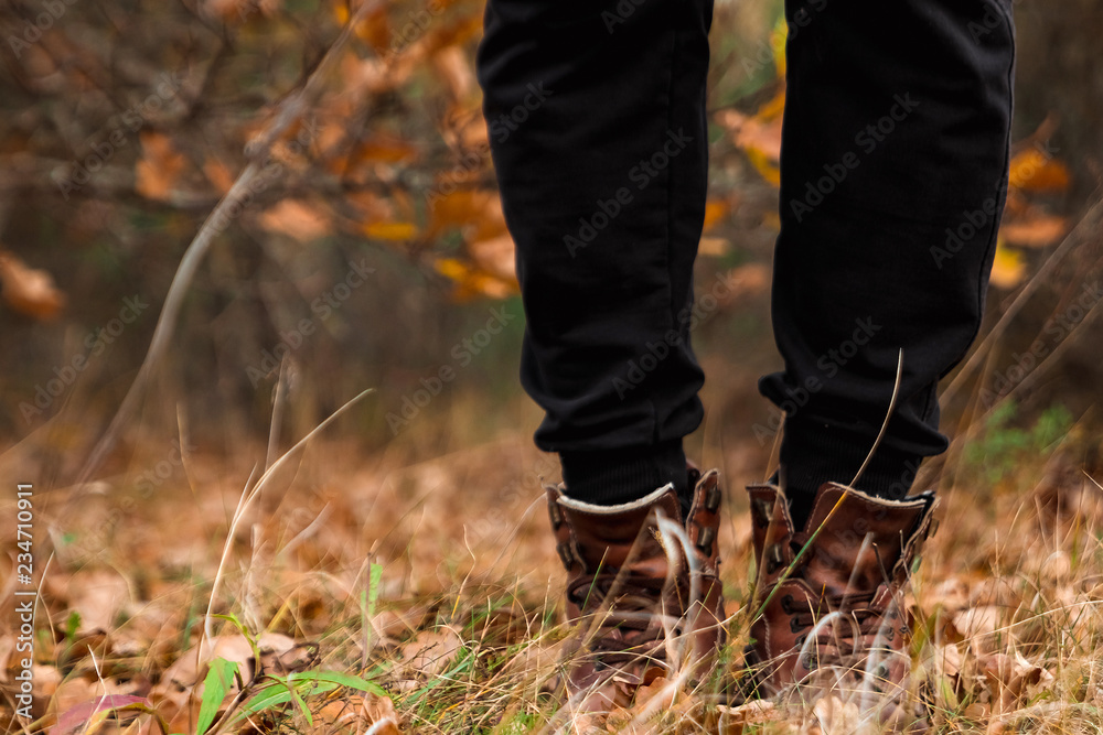 Man's shoe in autumn leaves. Autumn foliage on a hipster's shoe close up. Man's shoe in autumn leaves. Autumn foliage on a hipster's shoe close up.