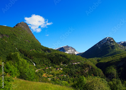 View on the mountain road and village in Geiranger. Norway