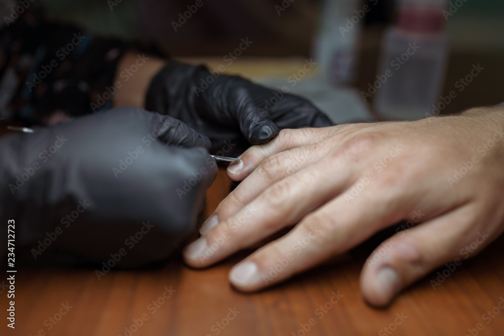 men's manicure close-up with a manicure specialist