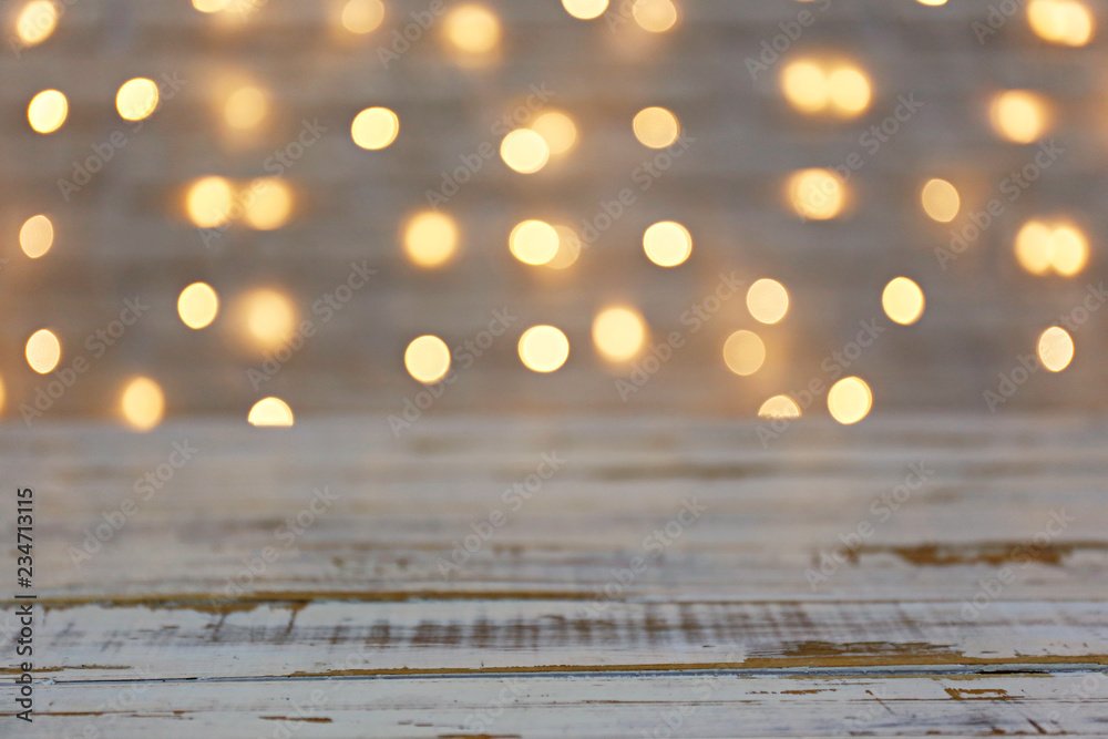 Selective focus. Soft yellow christmas lights with bokeh effect. Festive blurry texture background with many lit mini lamps, new year holiday decorations. Close up, copy space. - obrazy, fototapety, plakaty 