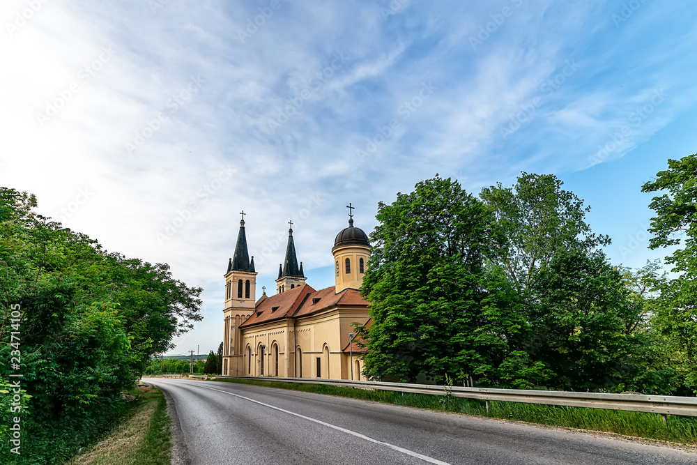 Fototapeta premium Petrovaradin, Serbia - May 02, 2018: Church of the Snow Lady on Tekija, Serbia. The church is a typical Roman Catholic church. 