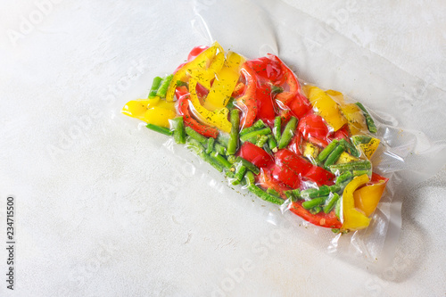 Vegetables in sealed vacuum packing bags. Su-video cooking. photo