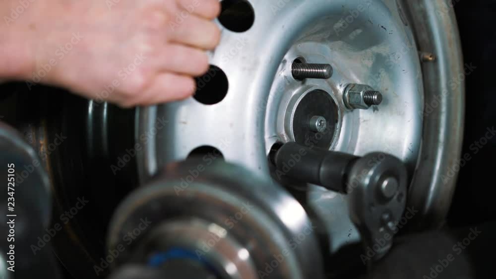 Equipment for car service and repair - tire machine for rolling and alignment of steel wheel rims close-up Equipment for car service and repair - tire machine for rolling and alignment of steel wheel rims close-up