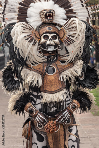 Skeleton warrior costume in Mexico. Dressed up with feathers costume for the Day of the Death photo