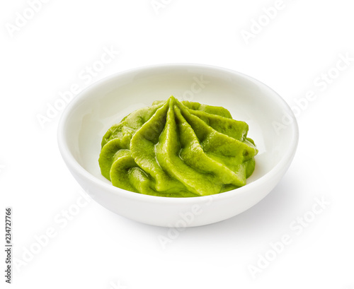 Wasabi in bowl isolated on white background photo