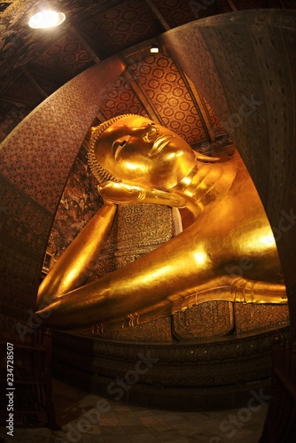 The largest golden  Reclinging Buddha in Wat Pho , Bangkok, Thailand.