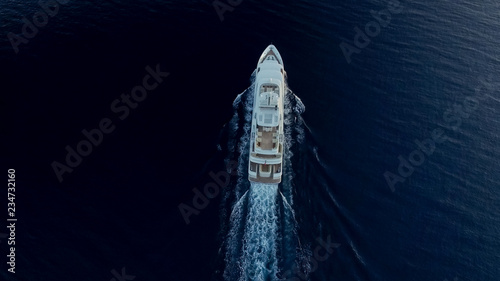 Top-down view of large super yacht underway