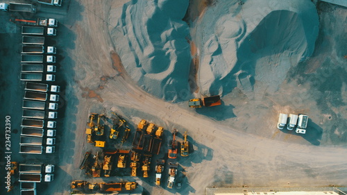 Aerial top view of crushed stone quarry machine in a construction material factory