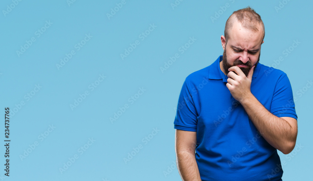Young caucasian hipster man wearing blue shirt over isolated background thinking looking tired and bored with depression problems with crossed arms. Young caucasian hipster man wearing blue shirt over isolated background thinking looking tired and bored with depression problems with crossed arms.