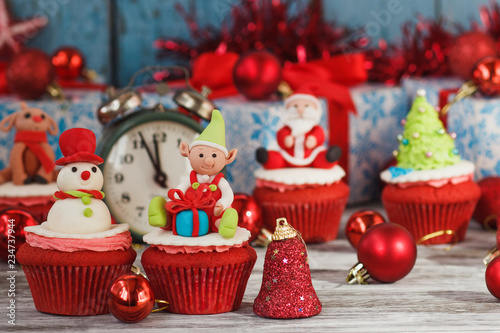 Christmas cupcakes with colored decorations, blurred background