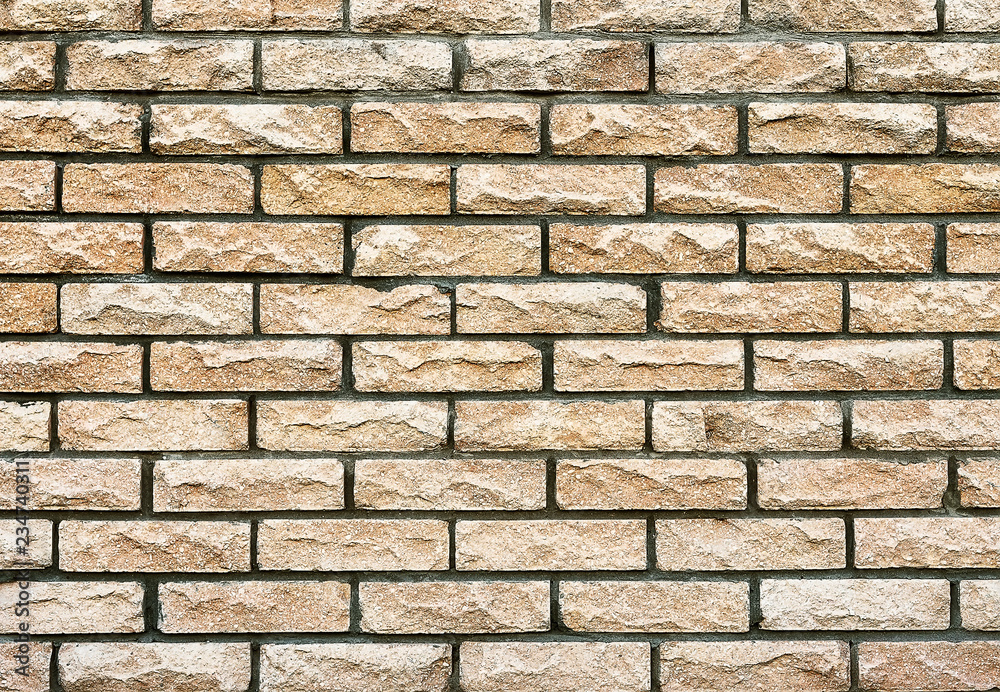 Obraz premium Old beige brick wall texture background