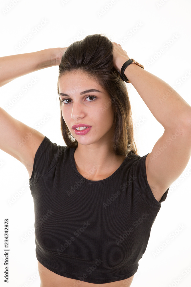 Portrait of beautiful sexy brunette girl touching hair and smiling on white background Portrait of beautiful sexy brunette girl touching hair and smiling on white background