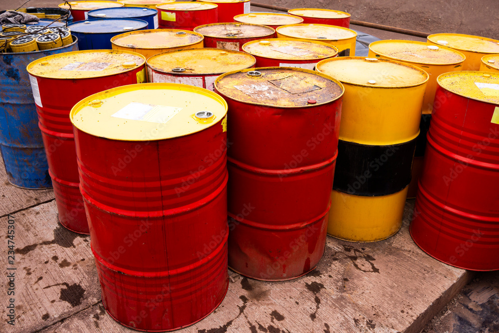 colored metal barrels. Blue oil drums containing fuel for transportation