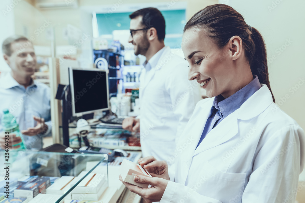 Man buys a mineral water in pharmacy Man buys a mineral water in pharmacy