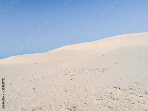 Amazing white dune  sand texture   blue sky pastel color  Brazil  Parna  ba. 