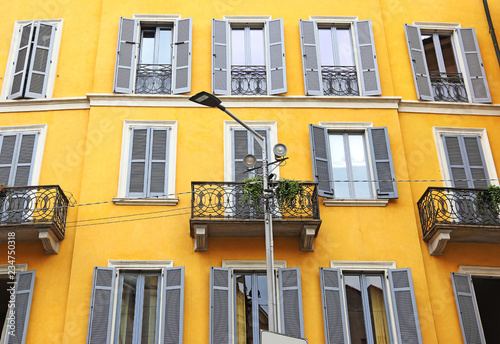 traditional architecture of Milan city Italy - building with yellow wall - italian architecture  