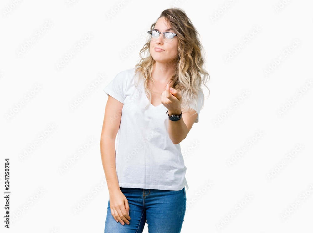 Beautiful young blonde woman wearing glasses over isolated background Beckoning come here gesture with hand inviting happy and smiling Beautiful young blonde woman wearing glasses over isolated background Beckoning come here gesture with hand inviting happy and smiling