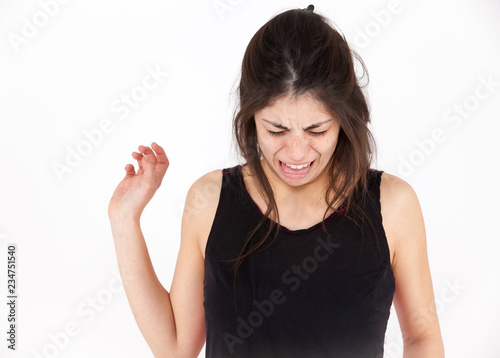 Contempt emotional girl on a light background