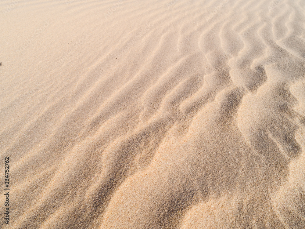 Beautiful structures of sandy dunes. sand with wave from wind in desert Beautiful structures of sandy dunes. sand with wave from wind in desert