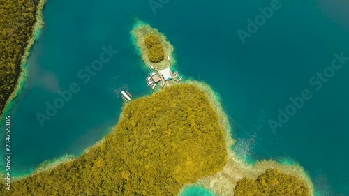 aerial footage lot islands in lagoon with turquoise water Bucas Grande Island Sohoton Cove. islands covered with green tropical forest surrounded by beautiful bays and lagoons tropical seascape blue photo