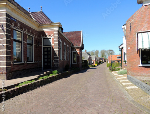 Central street in town Spijk, Dutch province Groningen, Netherlands © Zanoza-Ru