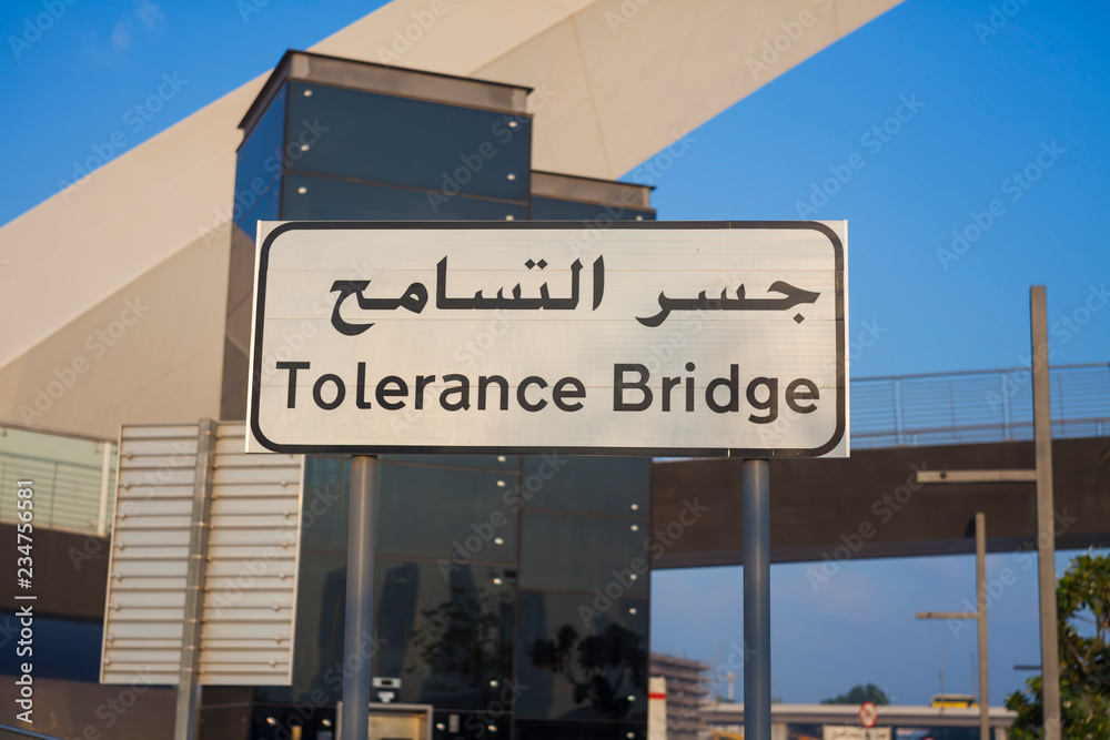 Obraz premium street sign to Tolerance Bridge, Dubai city. UAE