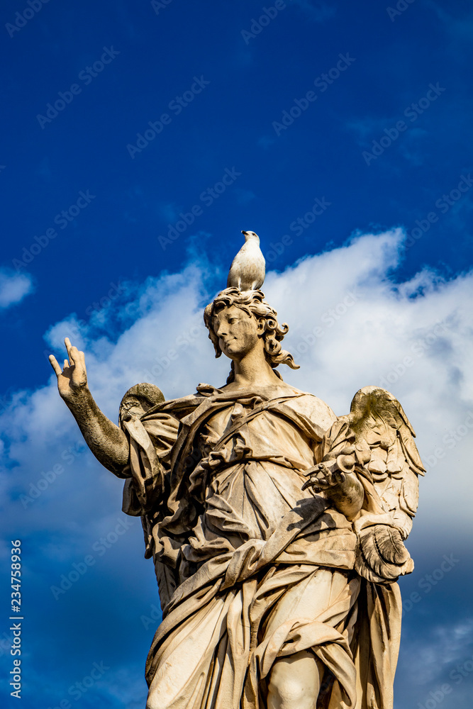 Angel with the nails on the Ponte Sant'Angelo over the Tiber, at the Mausoleum of Roman Emperor Hadrian, usually known as Castel Sant'Angelo, in Rome, near the Vatican. Italy