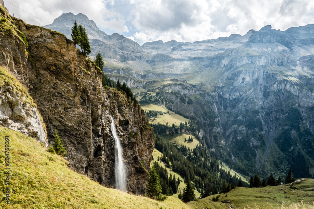 waterfall in the swiss alps, hiking in the kiental valley, switzerland waterfall in the swiss alps, hiking in the kiental valley, switzerland