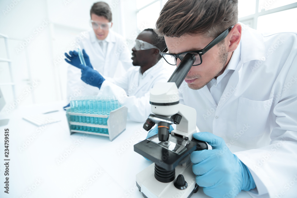 close up.the scientist uses a microscope for research. close up.the scientist uses a microscope for research.