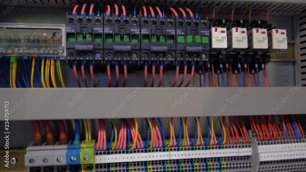 Electrical panel with multiple switches, wires, short circuit protection devices and electricity meter. Shot in motion Electrical panel with multiple switches, wires, short circuit protection devices and electricity meter. Shot in motion
