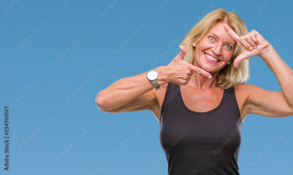 Middle age blonde woman over isolated background smiling making frame with hands and fingers with happy face. Creativity and photography concept. Middle age blonde woman over isolated background smiling making frame with hands and fingers with happy face. Creativity and photography concept.