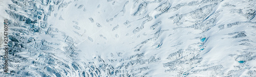 Amazing aerial detail of the Tunsbergdalsbreen glacier, showing the debris and moraine streams going down the glacier. photo