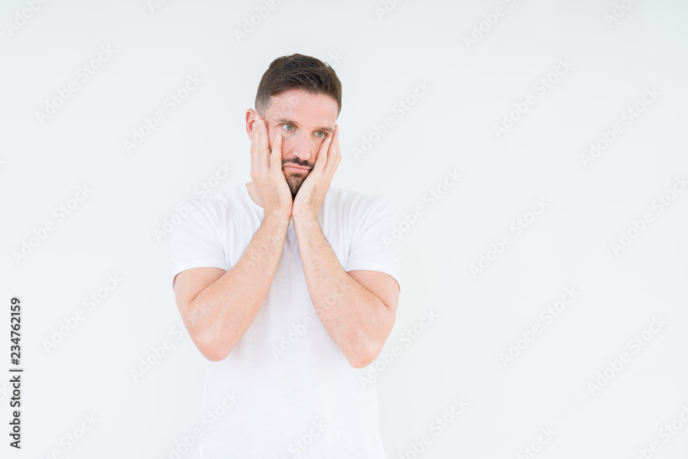 Young handsome man wearing casual white t-shirt over isolated background Tired hands covering face, depression and sadness, upset and irritated for problem Young handsome man wearing casual white t-shirt over isolated background Tired hands covering face, depression and sadness, upset and irritated for problem
