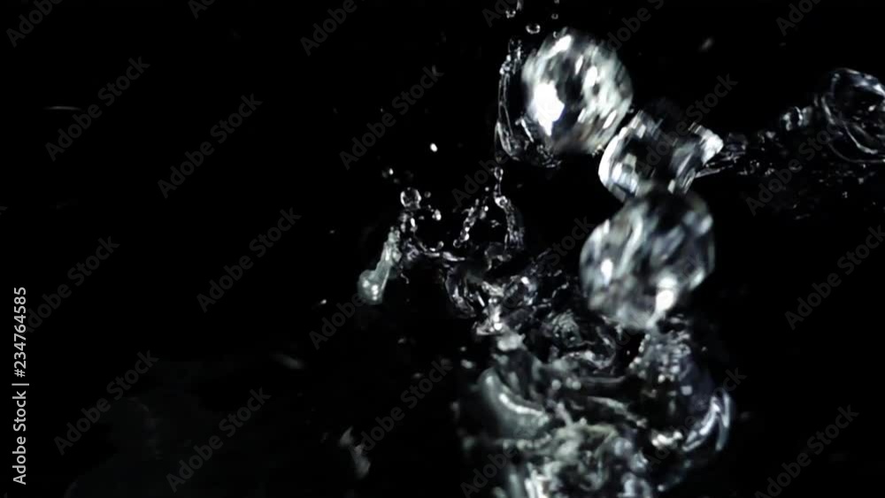 Falling of cubes of ice on a black background. Slow motion. Falling of cubes of ice on a black background. Slow motion.