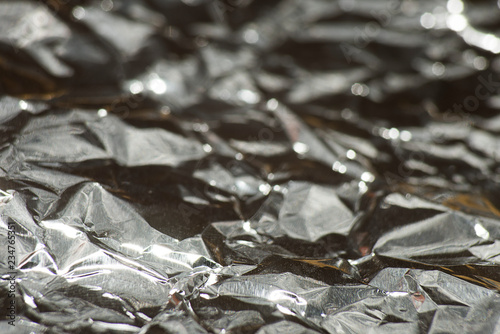 Crumpled foil with highlights and bokeh