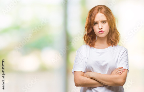 Young beautiful woman over isolated background skeptic and nervous, disapproving expression on face with crossed arms. Negative person. Free Download Young beautiful woman over isolated background skeptic and nervous, disapproving expression on face with crossed arms. Negative person. - GFXLoad