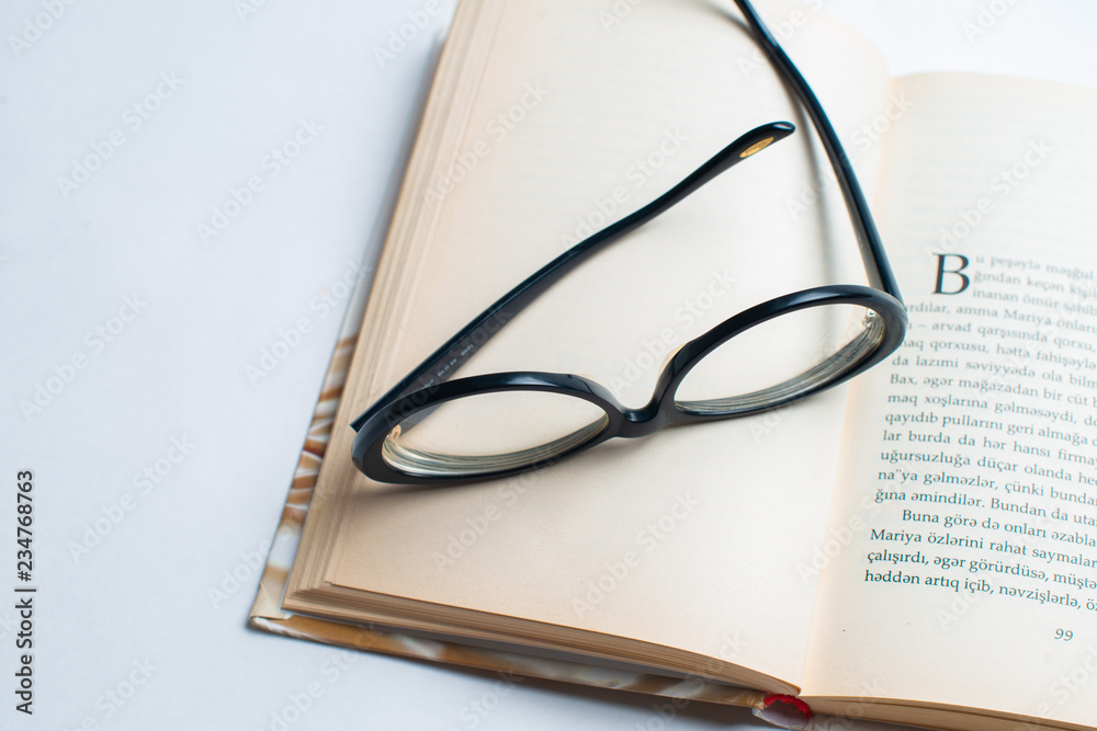 Notebook with glasses and pen, Book with glasses, Blue notebook with glasses, Book with cup of tea