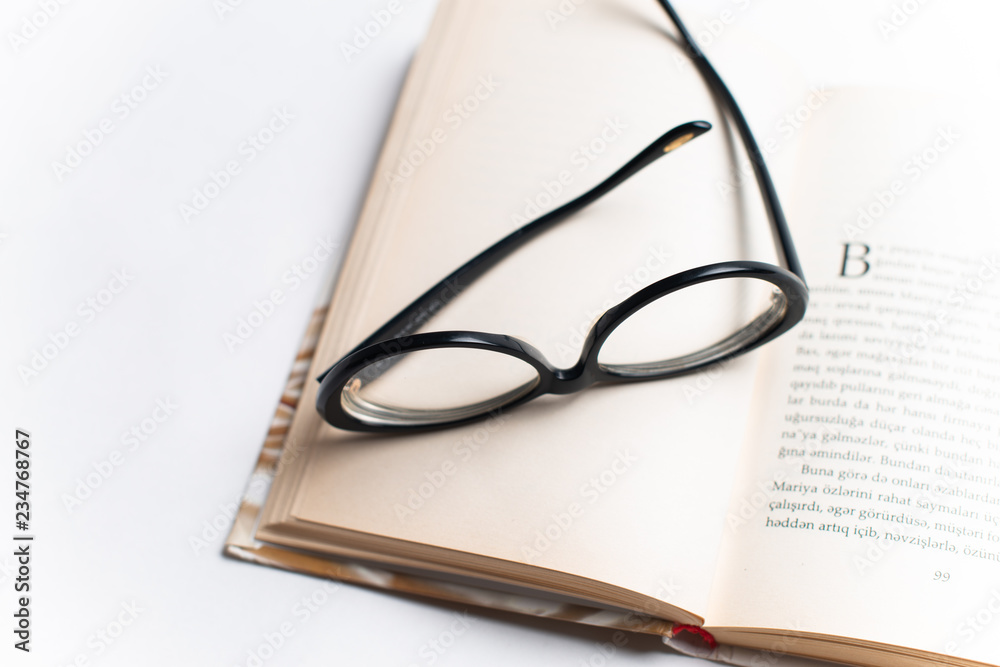 Notebook with glasses and pen, Book with glasses, Blue notebook with glasses, Book with cup of tea