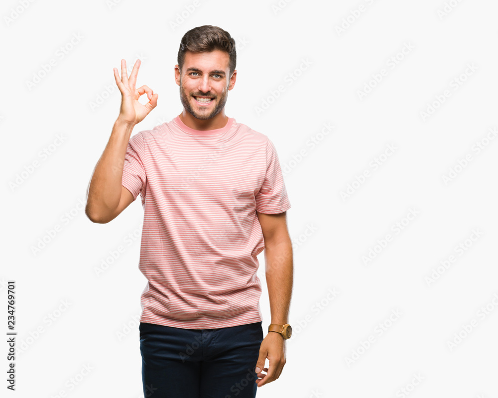 Young handsome man over isolated background smiling positive doing ok sign with hand and fingers. Successful expression. Young handsome man over isolated background smiling positive doing ok sign with hand and fingers. Successful expression.