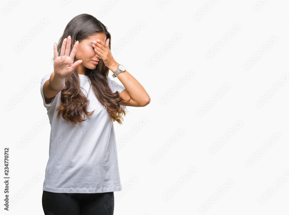 Young beautiful arab woman over isolated background covering eyes with hands and doing stop gesture with sad and fear expression. Embarrassed and negative concept. Young beautiful arab woman over isolated background covering eyes with hands and doing stop gesture with sad and fear expression. Embarrassed and negative concept.