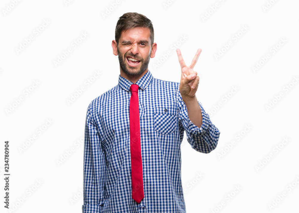 Young handsome business man over isolated background smiling with happy face winking at the camera doing victory sign. Number two. Young handsome business man over isolated background smiling with happy face winking at the camera doing victory sign. Number two.