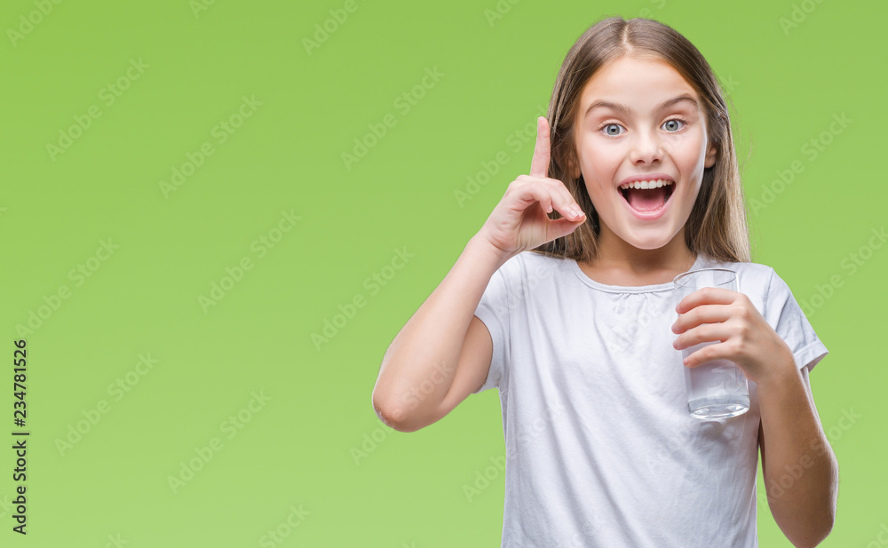 Young beautiful girl drinking glass of water over isolated background surprised with an idea or question pointing finger with happy face, number one