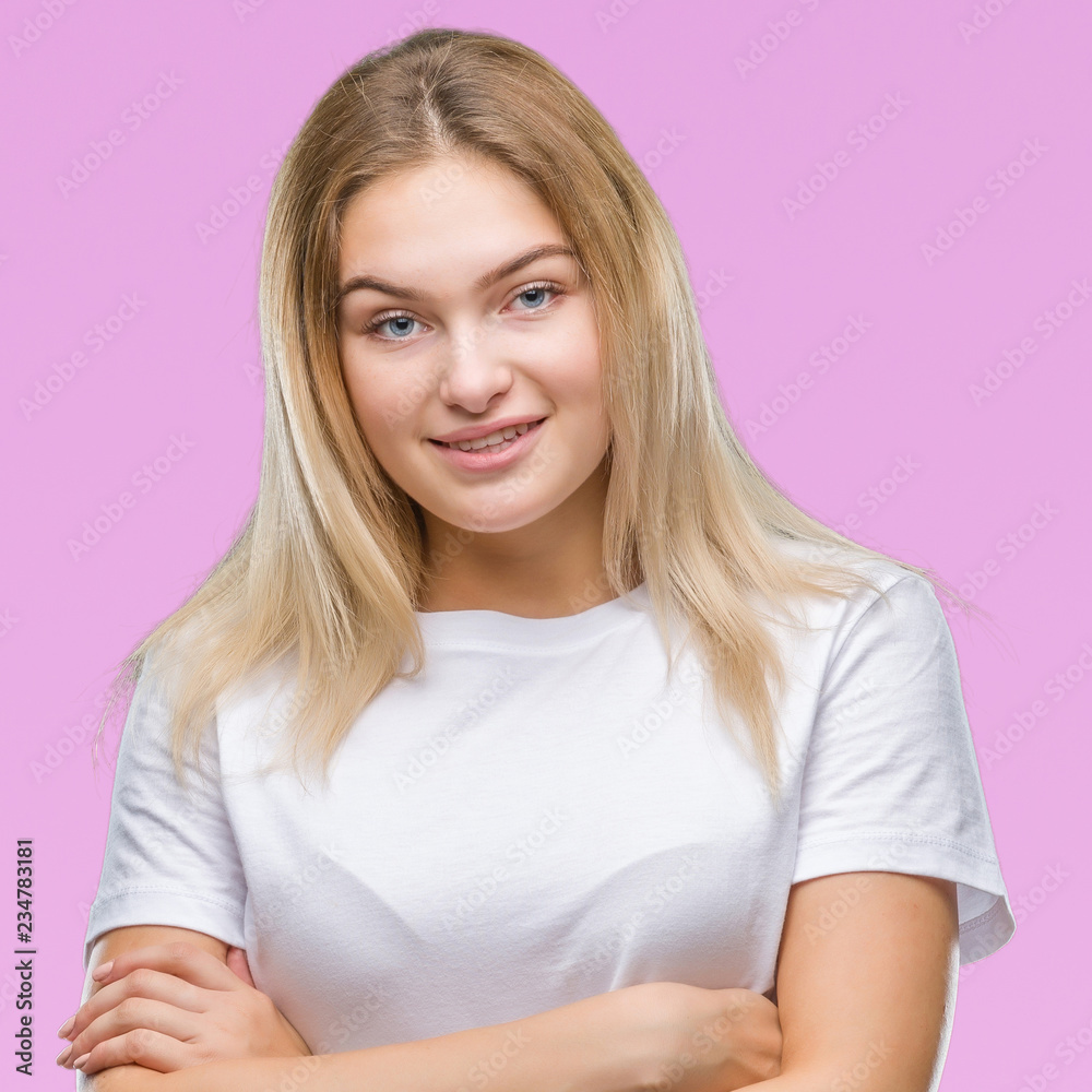 Young caucasian woman over isolated background happy face smiling with crossed arms looking at the camera. Positive person. Young caucasian woman over isolated background happy face smiling with crossed arms looking at the camera. Positive person.