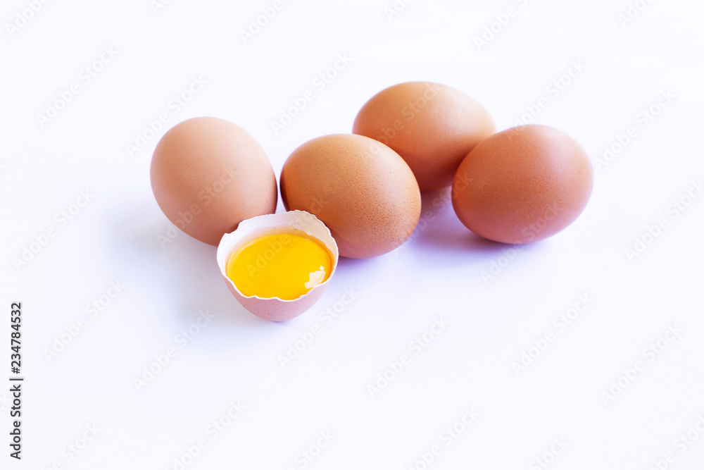 Chicken eggs with yolk on white background. Chicken eggs with yolk on white background.