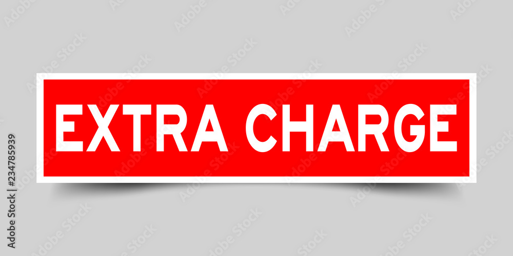 Square red sticker label in word extra charge on gray background Square red sticker label in word extra charge on gray background