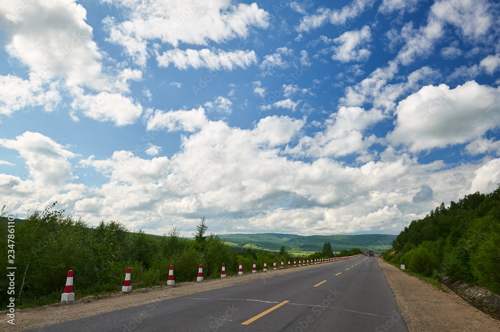 The beautiful cloudscape and road on the grassland.