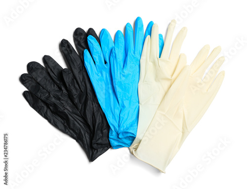 Different medical gloves on white background, top view © New Africa