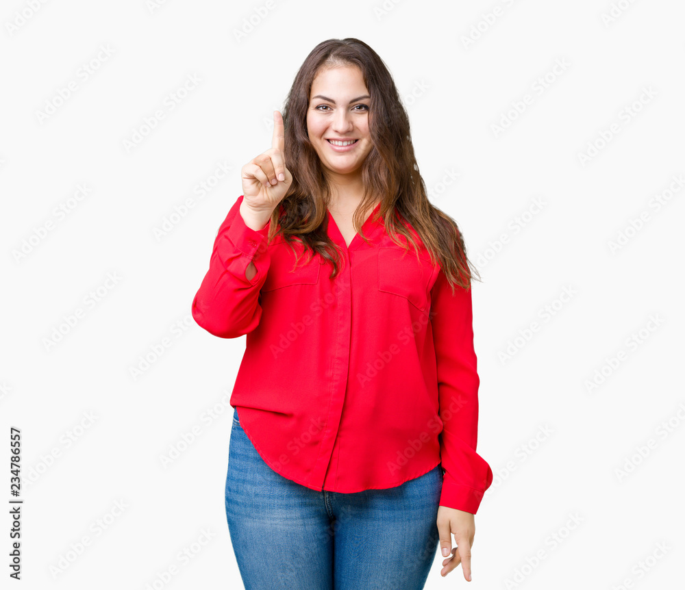Beautiful plus size young business woman over isolated background showing and pointing up with finger number one while smiling confident and happy.