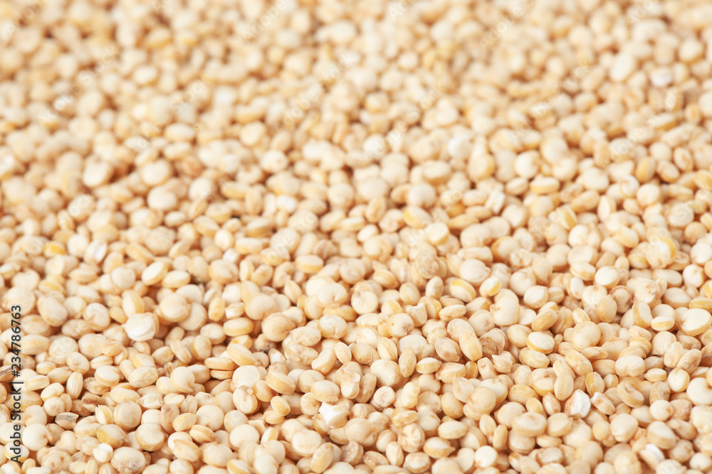 Raw white quinoa seeds as background, closeup Raw white quinoa seeds as background, closeup